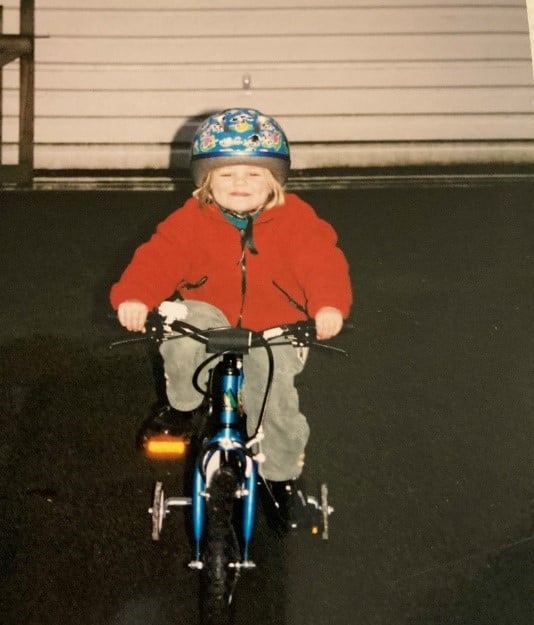 Young girl on bike.