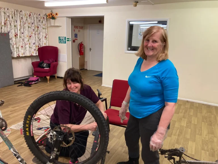 Two women at a bike maintenance workshop organised by Bingley Belles.