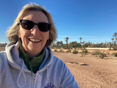 Woman with blonde hair and sunglasses in a desert