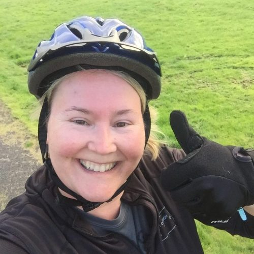 Woman cyclist selfie with thumb up.
