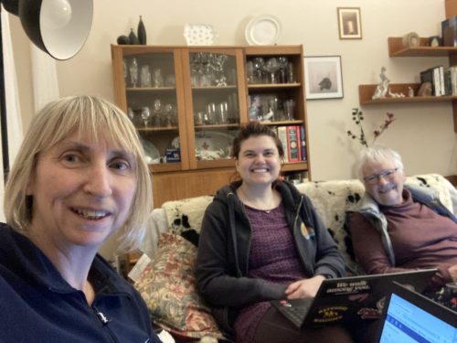 Picture of Sarah, Katie and Judy sitting with their computers