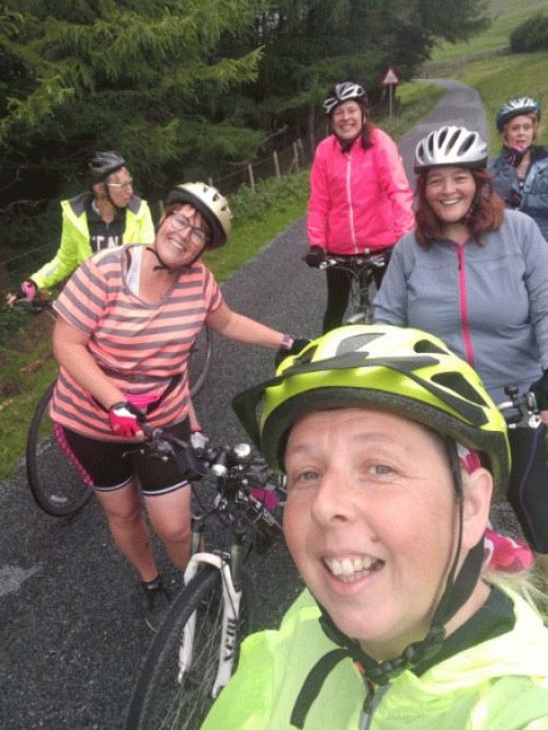 Selfie of women cyclists.
