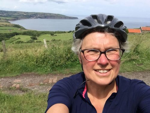 Selfie of cyclist by the sea.