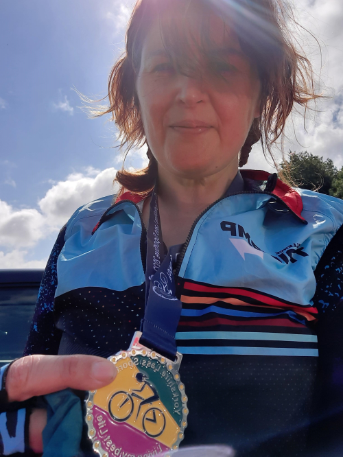 A picture of Lisa with a cycling medal